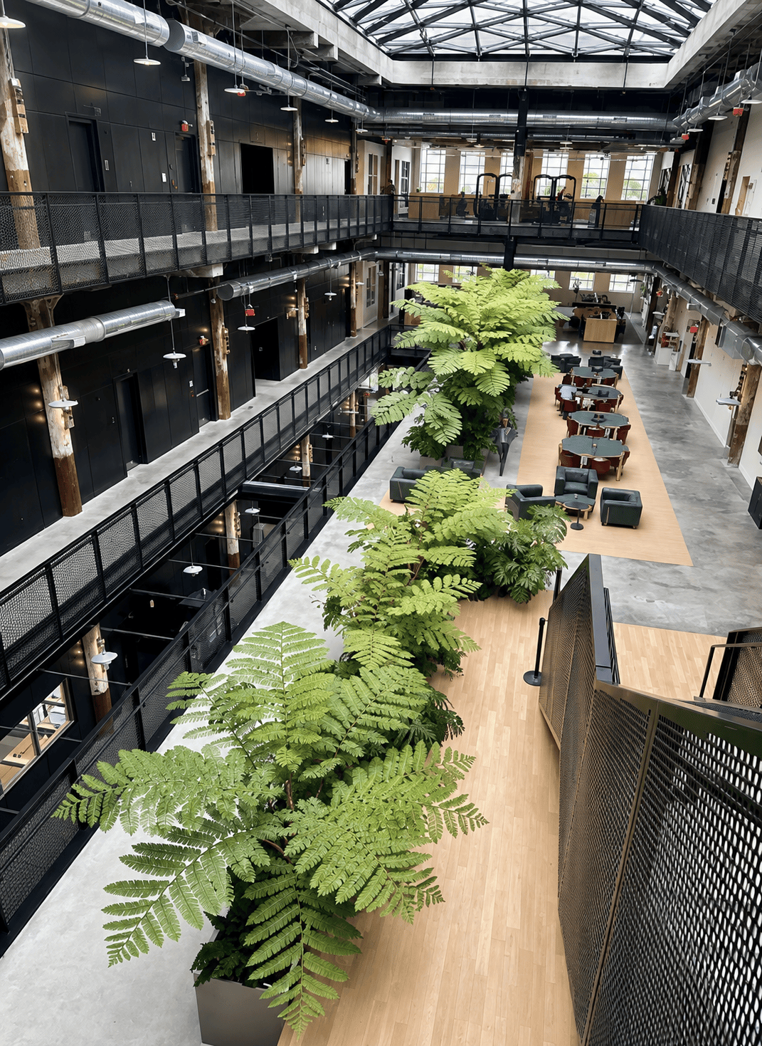 Corporate office atrium with indoor trees and lounge seating.